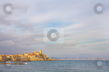 To use this stock image in your creative project, please select the size you need over to the right and click the "Add to Cart" button.
Your downloaded image will come with the Cutcaster watermark removed so don’t worry about the watermark you see on this page. Antibes #90 stock photo, A town overlooking the sea in Antibes, France. Copy space. by Sean Nel
