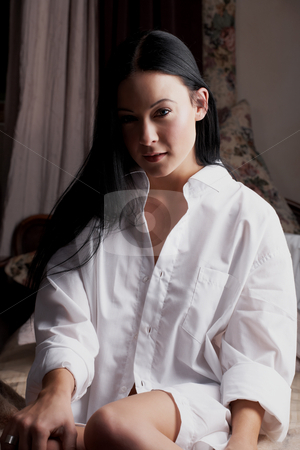 To use this stock image in your creative project, please select the size you need over to the right and click the "Add to Cart" button.
Your downloaded image will come with the Cutcaster watermark removed so don’t worry about the watermark you see on this page. Intimate young lovers stock photo, Young adult Caucasian couple in passionate embrace and undressing each other during sexual foreplay by Sean Nel