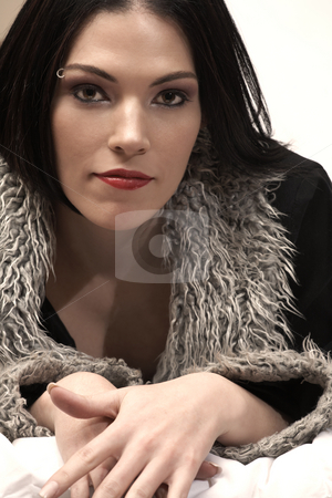To use this stock image in your creative project, please select the size you need over to the right and click the "Add to Cart" button.
Your downloaded image will come with the Cutcaster watermark removed so don’t worry about the watermark you see on this page. Nude adult woman stock photo, Sensual naked young Black haired adult Caucasian woman, wrapped in a black fur lined coat on a bed in her bedroom. High contrast lighting. by Sean Nel