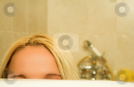 To use this stock image in your creative project, please select the size you need over to the right and click the "Add to Cart" button.
Your downloaded image will come with the Cutcaster watermark removed so don’t worry about the watermark you see on this page. Woman #168 stock photo, Woman peeking over a bath. Shallow D.O.F by Sean Nel