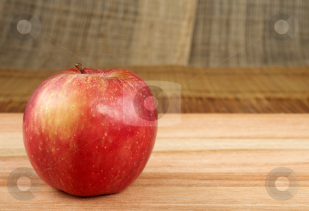 To use this stock image in your creative project, please select the size you need over to the right and click the "Add to Cart" button.
Your downloaded image will come with the Cutcaster watermark removed so don’t worry about the watermark you see on this page. Apple #2 stock photo, Red apple on wooden cutting board - copy space by Sean Nel