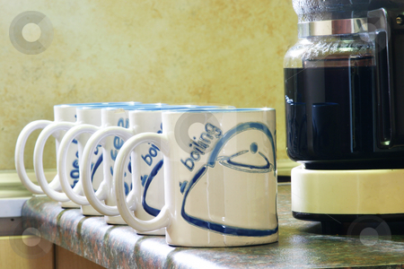 To use this stock image in your creative project, please select the size you need over to the right and click the "Add to Cart" button.
Your downloaded image will come with the Cutcaster watermark removed so don’t worry about the watermark you see on this page. Coffee Mugs stock photo, Coffe mugs lined up next to coffee pot by Sean Nel