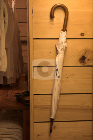 To use this stock image in your creative project, please select the size you need over to the right and click the "Add to Cart" button.
Your downloaded image will come with the Cutcaster watermark removed so don’t worry about the watermark you see on this page. Fashion accessories stock photo, White umbrella hanging against the wall by Sean Nel