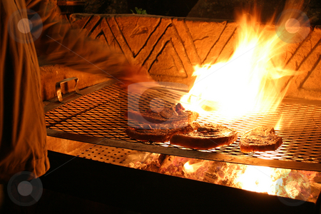 To use this stock image in your creative project, please select the size you need over to the right and click the "Add to Cart" button.
Your downloaded image will come with the Cutcaster watermark removed so don’t worry about the watermark you see on this page. Flamed Steaks stock photo, Flame grilled steaks by Sean Nel
