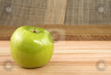 To use this stock image in your creative project, please select the size you need over to the right and click the "Add to Cart" button.
Your downloaded image will come with the Cutcaster watermark removed so don’t worry about the watermark you see on this page. Apple #3 stock photo, Green apple on wooden cutting board - copy space by Sean Nel