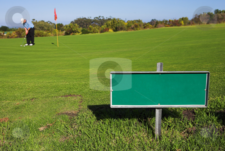 To use this stock image in your creative project, please select the size you need over to the right and click the "Add to Cart" button.
Your downloaded image will come with the Cutcaster watermark removed so don’t worry about the watermark you see on this page. Gofer #41 stock photo, A golfer playing golf on a green. Shallow D.O.F - sign in focus, golfer out of focus. by Sean Nel