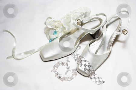 To use this stock image in your creative project, please select the size you need over to the right and click the "Add to Cart" button.
Your downloaded image will come with the Cutcaster watermark removed so don’t worry about the watermark you see on this page. Shoes #11 stock photo, White satin wedding shoes by Sean Nel