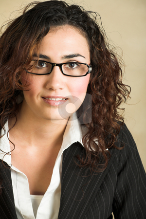 To use this stock image in your creative project, please select the size you need over to the right and click the "Add to Cart" button.
Your downloaded image will come with the Cutcaster watermark removed so don’t worry about the watermark you see on this page. Young adult businesswoman stock photo, Portrait of a beautiful young adult Caucasian businesswoman with light skin and curly brown hair, brown eyes and pink lips, wearing a pinstripe Jacket and white shirt with spectacles by Sean Nel