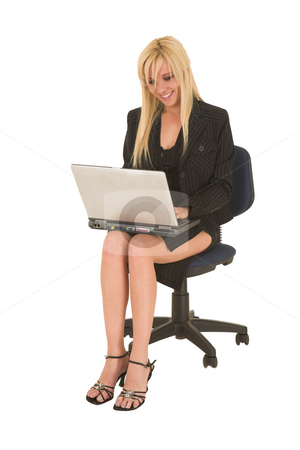 To use this stock image in your creative project, please select the size you need over to the right and click the "Add to Cart" button.
Your downloaded image will come with the Cutcaster watermark removed so don’t worry about the watermark you see on this page. Sexy blonde businesswoman stock photo, Sexy young adult Caucasian businesswoman in black pinstripe pencil skirt and suit jacket on a white background, sitting on an office chair with a notebook computer by Sean Nel