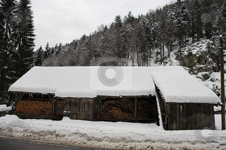 To use this stock image in your creative project, please select the size you need over to the right and click the "Add to Cart" button.
Your downloaded image will come with the Cutcaster watermark removed so don’t worry about the watermark you see on this page. Snow Landscape #14 stock photo, Small Snowcovered firewood barn in the German Alps by Sean Nel