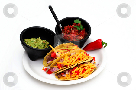 To use this stock image in your creative project, please select the size you need over to the right and click the "Add to Cart" button.
Your downloaded image will come with the Cutcaster watermark removed so don’t worry about the watermark you see on this page. Taco Meal stock photo, Tacos with cheese, ground beef, tomatoes and onions with guacamole and fresh salsa on the side isolated on white by Lynn Bendickson