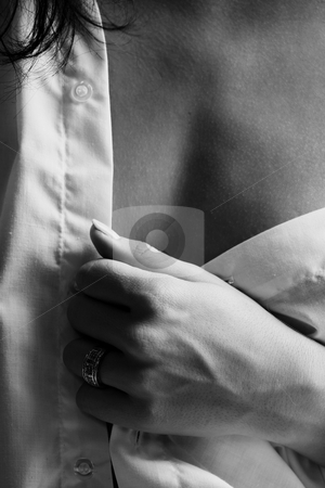 To use this stock image in your creative project, please select the size you need over to the right and click the "Add to Cart" button.
Your downloaded image will come with the Cutcaster watermark removed so don’t worry about the watermark you see on this page. Intimate young lovers stock photo, Young adult Caucasian woman in a white shirt and lingerie, undressing as a part of foreplay by Sean Nel