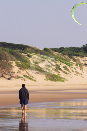 To use this stock image in your creative project, please select the size you need over to the right and click the "Add to Cart" button.
Your downloaded image will come with the Cutcaster watermark removed so don’t worry about the watermark you see on this page. Sudwana #21 stock photo, Man walking on the beach. Kite flying in the air. by Sean Nel
