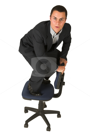 To use this stock image in your creative project, please select the size you need over to the right and click the "Add to Cart" button.
Your downloaded image will come with the Cutcaster watermark removed so don’t worry about the watermark you see on this page. Businessman #231 stock photo, Businessman wearing a suit and a grey shirt. Making a stunt on an office chair by Sean Nel