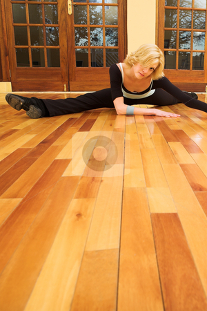 To use this stock image in your creative project, please select the size you need over to the right and click the "Add to Cart" button.
Your downloaded image will come with the Cutcaster watermark removed so don’t worry about the watermark you see on this page. Dancer #40 stock photo, A Female Dancer practicing in her studio - in a split, on the floor - Copy Space by Sean Nel