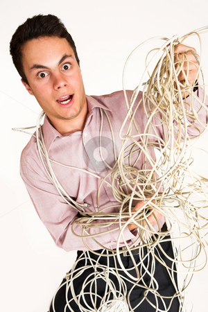 To use this stock image in your creative project, please select the size you need over to the right and click the "Add to Cart" button.
Your downloaded image will come with the Cutcaster watermark removed so don’t worry about the watermark you see on this page. Businessman #126 stock photo, Businessman tangled up in power cables by Sean Nel