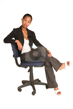 To use this stock image in your creative project, please select the size you need over to the right and click the "Add to Cart" button.
Your downloaded image will come with the Cutcaster watermark removed so don’t worry about the watermark you see on this page. Mida Matsimela #22 stock photo, African business woman dressed in black jacket. Sitting on office chair by Sean Nel