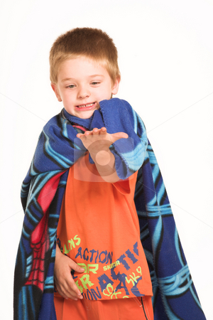 To use this stock image in your creative project, please select the size you need over to the right and click the "Add to Cart" button.
Your downloaded image will come with the Cutcaster watermark removed so don’t worry about the watermark you see on this page. Kids #1 stock photo, A boy wearing a blanket as a cape, looking at his hand. by Sean Nel