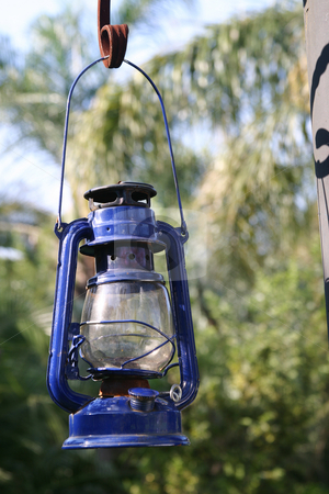 To use this stock image in your creative project, please select the size you need over to the right and click the "Add to Cart" button.
Your downloaded image will come with the Cutcaster watermark removed so don’t worry about the watermark you see on this page. Blue storm Lantern stock photo, Hanging blue storm lantern by Sean Nel