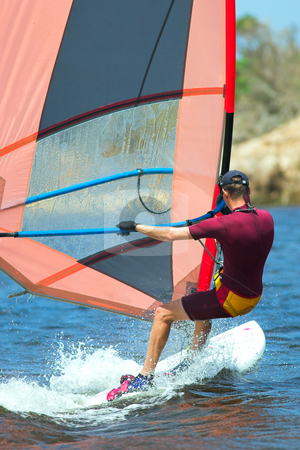 To use this stock image in your creative project, please select the size you need over to the right and click the "Add to Cart" button.
Your downloaded image will come with the Cutcaster watermark removed so don’t worry about the watermark you see on this page. Windsurfer #17 stock photo, Fast moving windsurfer on the water at Keurbooms Lagoon, South Africa by Sean Nel
