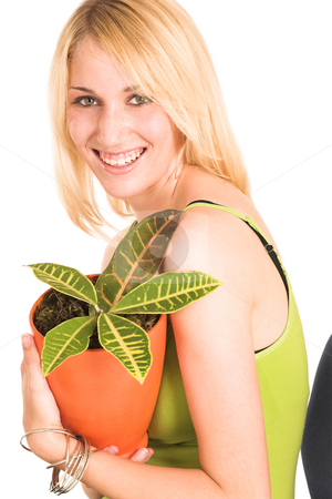 To use this stock image in your creative project, please select the size you need over to the right and click the "Add to Cart" button.
Your downloaded image will come with the Cutcaster watermark removed so don’t worry about the watermark you see on this page. Businesswoman #461 stock photo, Blonde business lady in an informal green top. Holding a pot plant, lauching. by Sean Nel