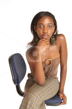 To use this stock image in your creative project, please select the size you need over to the right and click the "Add to Cart" button.
Your downloaded image will come with the Cutcaster watermark removed so don’t worry about the watermark you see on this page. Cynthia Akva #1 stock photo, African business woman dressed in neutral coloured clothes. Sitting on office chair. by Sean Nel