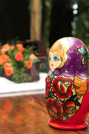 To use this stock image in your creative project, please select the size you need over to the right and click the "Add to Cart" button.
Your downloaded image will come with the Cutcaster watermark removed so don’t worry about the watermark you see on this page. Red and purple stacking doll stock photo, Traditional Russian red and purple nested doll or stacking doll (matryoshka) on a table with flowers in the background by Sean Nel
