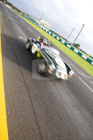 To use this stock image in your creative project, please select the size you need over to the right and click the "Add to Cart" button.
Your downloaded image will come with the Cutcaster watermark removed so don’t worry about the watermark you see on this page. Speeding racer on racetrack stock photo, Starting grid in front of the pit lane of Killarney Race Track in the Western Cape, South Africa. Cloudy and wet race day. Green car racing by (movement on racer, road in focus) by Sean Nel