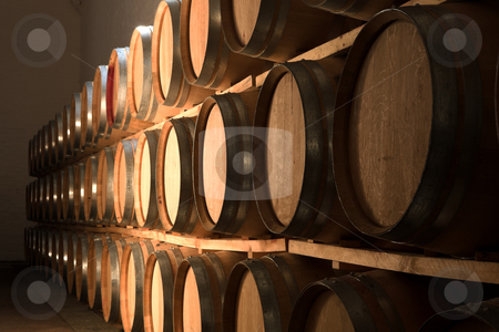 To use this stock image in your creative project, please select the size you need over to the right and click the "Add to Cart" button.
Your downloaded image will come with the Cutcaster watermark removed so don’t worry about the watermark you see on this page. Oak barrels maturing red wine and brandy stock photo, Stacked Oak barrels for maturing red wine and brandy in a cooling cellar. Made from American and Canadian oak and stacked in rows. (low noise HDR file by Sean Nel