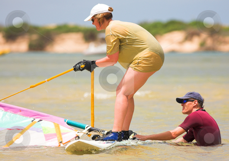 To use this stock image in your creative project, please select the size you need over to the right and click the "Add to Cart" button.
Your downloaded image will come with the Cutcaster watermark removed so don’t worry about the watermark you see on this page. Windsurfer in training stock photo, Windsurfer in training on the water at Keurbooms Lagoon, South Africa by Sean Nel