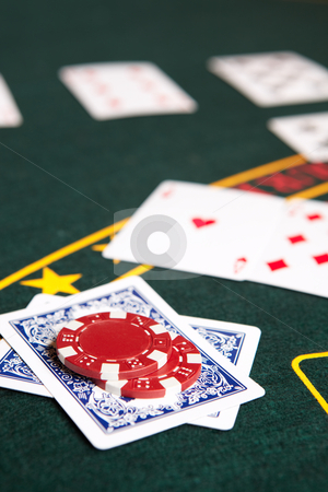 To use this stock image in your creative project, please select the size you need over to the right and click the "Add to Cart" button.
Your downloaded image will come with the Cutcaster watermark removed so don’t worry about the watermark you see on this page. Card gambling stock photo, Playing cards, chips and players gambling around a green felt poker table. Shallow Depth of field by Sean Nel