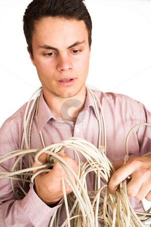 To use this stock image in your creative project, please select the size you need over to the right and click the "Add to Cart" button.
Your downloaded image will come with the Cutcaster watermark removed so don’t worry about the watermark you see on this page. Businessman #124 stock photo, Businessman tangled up in power cables by Sean Nel