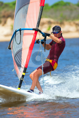 To use this stock image in your creative project, please select the size you need over to the right and click the "Add to Cart" button.
Your downloaded image will come with the Cutcaster watermark removed so don’t worry about the watermark you see on this page. Windsurfer #15 stock photo, Fast moving windsurfer on the water at Keurbooms Lagoon, South Africa by Sean Nel