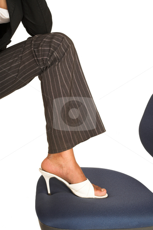 To use this stock image in your creative project, please select the size you need over to the right and click the "Add to Cart" button.
Your downloaded image will come with the Cutcaster watermark removed so don’t worry about the watermark you see on this page. Mida Matsimela #19 stock photo, African business woman dressed in black jacket, white shoes and brown pinstripe pants. Foot on office chair. by Sean Nel