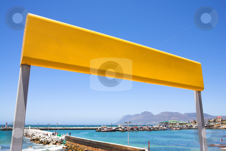 To use this stock image in your creative project, please select the size you need over to the right and click the "Add to Cart" button.
Your downloaded image will come with the Cutcaster watermark removed so don’t worry about the watermark you see on this page. Yellow train station sign at the coast stock photo, Yellow train station sign against a blue sky with the Kalk Bay harbour in the background by Sean Nel