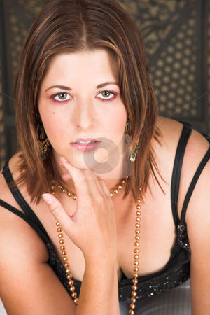 To use this stock image in your creative project, please select the size you need over to the right and click the "Add to Cart" button.
Your downloaded image will come with the Cutcaster watermark removed so don’t worry about the watermark you see on this page. Sexy adult woman stock photo, Beautiful young sexy adult brunette woman with long auburn hair, in formal black dress on a wooden textured background by Sean Nel