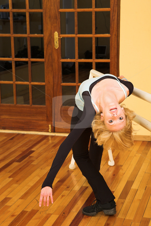 To use this stock image in your creative project, please select the size you need over to the right and click the "Add to Cart" button.
Your downloaded image will come with the Cutcaster watermark removed so don’t worry about the watermark you see on this page. Dancer #36 stock photo, A Female Dancer practicing in her studio, on pointe, at barre by Sean Nel