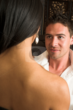 To use this stock image in your creative project, please select the size you need over to the right and click the "Add to Cart" button.
Your downloaded image will come with the Cutcaster watermark removed so don’t worry about the watermark you see on this page. Intimate lovers embrace stock photo, Multi-ethnic couple in passionate embrace and undressing each other during sexual foreplay by Sean Nel
