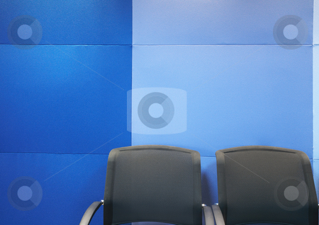 To use this stock image in your creative project, please select the size you need over to the right and click the "Add to Cart" button.
Your downloaded image will come with the Cutcaster watermark removed so don’t worry about the watermark you see on this page. Office chairs against blue wall
Office chairs against blue wall
stock photo, Two grey office chairs against blue soundproof blue panels in a modern boardroom by Sean Nel