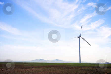 To use this stock image in your creative project, please select the size you need over to the right and click the "Add to Cart" button.
Your downloaded image will come with the Cutcaster watermark removed so don’t worry about the watermark you see on this page. Eco friendly windpower stock photo, Wind powered electricity generator standing against the blue sky in a green field on the wind farm. A man is walking past the first generator by Sean Nel