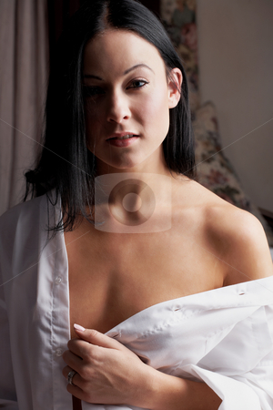 To use this stock image in your creative project, please select the size you need over to the right and click the "Add to Cart" button.
Your downloaded image will come with the Cutcaster watermark removed so don’t worry about the watermark you see on this page. Sexy adult woman stock photo, Sexy young adult Caucasian woman with black hair, smooth skin and blue contact lenses in her eyes. by Sean Nel