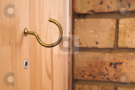 To use this stock image in your creative project, please select the size you need over to the right and click the "Add to Cart" button.
Your downloaded image will come with the Cutcaster watermark removed so don’t worry about the watermark you see on this page. Hook #1 stock photo, Hook on wooden panel, brick wall in background by Sean Nel