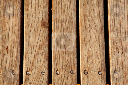 To use this stock image in your creative project, please select the size you need over to the right and click the "Add to Cart" button.
Your downloaded image will come with the Cutcaster watermark removed so don’t worry about the watermark you see on this page. Wooden deck #1 stock photo, Old brown decking by Sean Nel