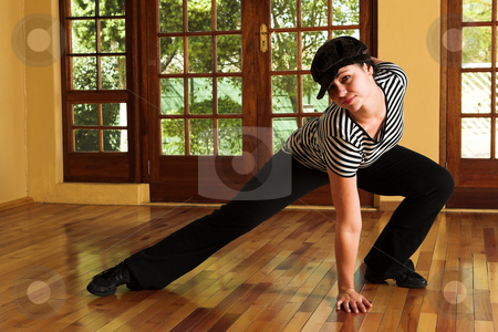 To use this stock image in your creative project, please select the size you need over to the right and click the "Add to Cart" button.
Your downloaded image will come with the Cutcaster watermark removed so don’t worry about the watermark you see on this page. Sexy modern dancer in Black hat and striped top stock photo, Modern Dancer in black Hat and striped top - Practicing in Studio by Sean Nel