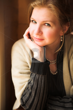 To use this stock image in your creative project, please select the size you need over to the right and click the "Add to Cart" button.
Your downloaded image will come with the Cutcaster watermark removed so don’t worry about the watermark you see on this page. Beautiful adult woman next to window stock photo, Blonde adult woman next to a natural light window in the beginning of winter. Shallow Depth of Field by Sean Nel