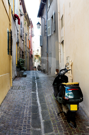 To use this stock image in your creative project, please select the size you need over to the right and click the "Add to Cart" button.
Your downloaded image will come with the Cutcaster watermark removed so don’t worry about the watermark you see on this page. Backstreet scooter stock photo, Black scooter on the backstreets of Cannes, France - Right back lights broken by Sean Nel