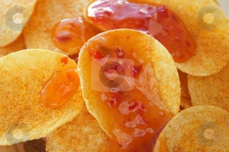 To use this stock image in your creative project, please select the size you need over to the right and click the "Add to Cart" button.
Your downloaded image will come with the Cutcaster watermark removed so don’t worry about the watermark you see on this page. Chips and dip stock photo, Crispy golden brown potato chips with a hot salsa dip sauce on a wooden presentation plate (shallow depth of field) by Sean Nel