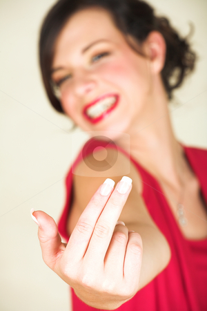 To use this stock image in your creative project, please select the size you need over to the right and click the "Add to Cart" button.
Your downloaded image will come with the Cutcaster watermark removed so don’t worry about the watermark you see on this page. Young adult businesswoman stock photo, Young Caucasian adult businesswoman in a red, discreet, office wear making a hand signal - Very shallow Depth of Field, Focus on fingers by Sean Nel