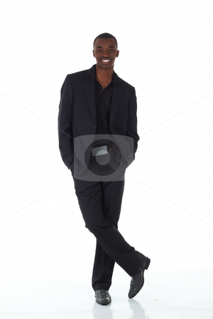 To use this stock image in your creative project, please select the size you need over to the right and click the "Add to Cart" button.
Your downloaded image will come with the Cutcaster watermark removed so don’t worry about the watermark you see on this page. Black African businessman stock photo, Young Adult black african businessman wearing a dark smart-casual suit and Jacket on a white background in various poses with various facial expressions. Part of a series, Not Isolated. by Sean Nel
