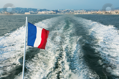 To use this stock image in your creative project, please select the size you need over to the right and click the "Add to Cart" button.
Your downloaded image will come with the Cutcaster watermark removed so don’t worry about the watermark you see on this page. IsleDeMarguerite #4 stock photo, Leaving the Harbour in Cannes, France on a speedboat - French flag blowing in the wind by Sean Nel